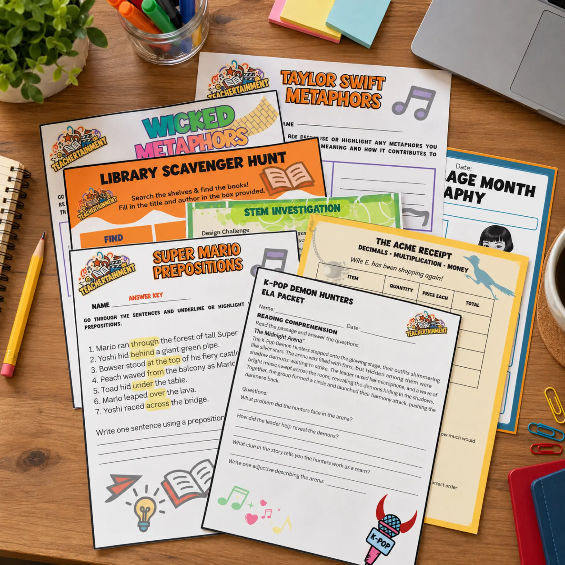 Colorful Teachertainment worksheets spread across a teacher's desk